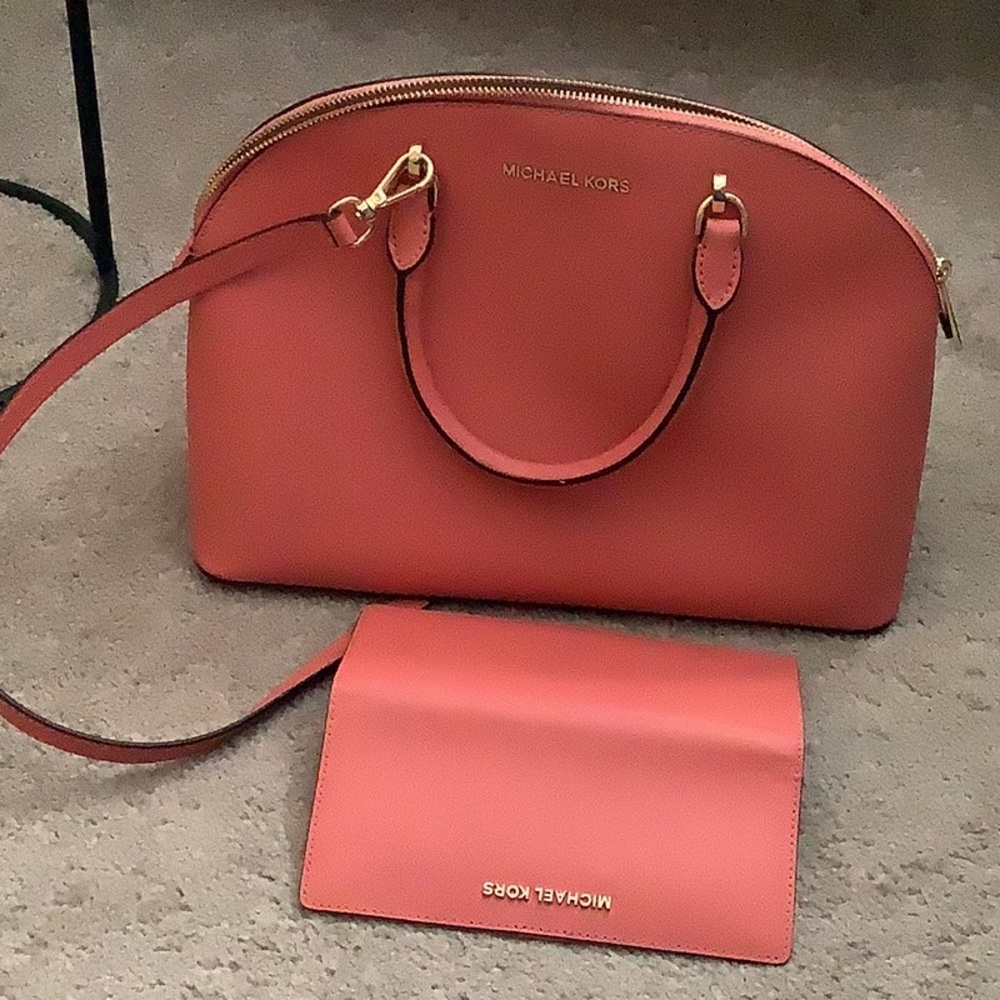 Michael Kors satchel and matching wallet.